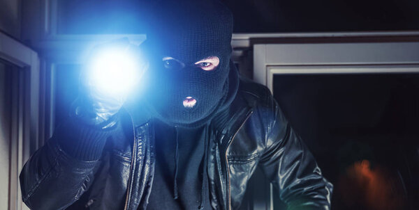 burglar breaks into house at night