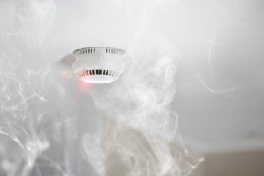 Smoke detector in apartment clipart