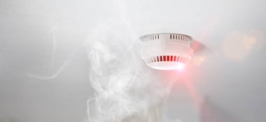 Smoke detector in apartment clipart