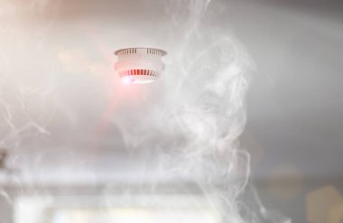 Smoke detector in apartment clipart