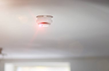 Smoke detector in apartment clipart