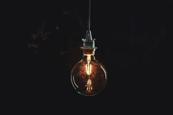 Vintage lightbulb on dark background — Stock Photo, Image