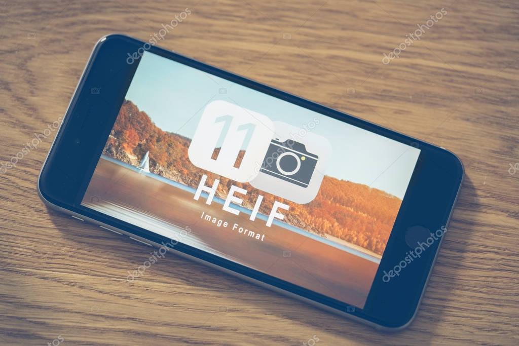 AACHEN, GERMANY - JUNE 22, 2017: HEIF Logo on  Apple iPone 7. HEIF is a new image compression used by apple in iOS 11 to reduce the storage on mobile devices, developed by the Moving Picture Experts Group (MPEG).
