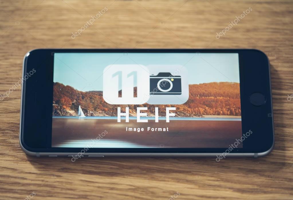 AACHEN, GERMANY - JUNE 22, 2017: HEIF Logo on  Apple iPone 7. HEIF is a new image compression used by apple in iOS 11 to reduce the storage on mobile devices, developed by the Moving Picture Experts Group (MPEG).