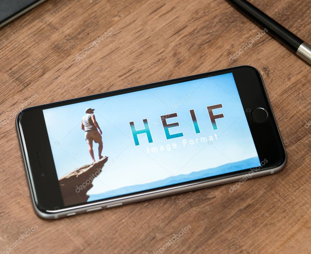 AACHEN, GERMANY - JUNE 22, 2017: HEIF Logo on  Apple iPone 7. HEIF is a new image compression used by apple in iOS 11 to reduce the storage on mobile devices, developed by the Moving Picture Experts Group (MPEG).
