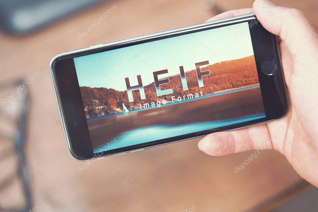 AACHEN, GERMANY - JUNE 22, 2017: HEIF Logo on  Apple iPone 7. HEIF is a new image compression used by apple in iOS 11 to reduce the storage on mobile devices, developed by the Moving Picture Experts Group (MPEG).