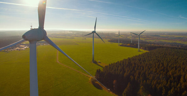 Windmills at windfarm on a sunny summer day