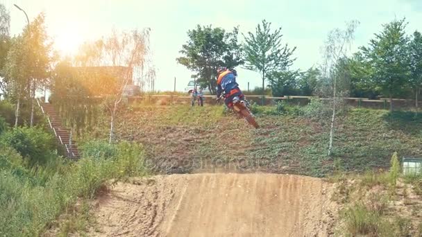 Motocross Rider riding on dirt track — Stock Video