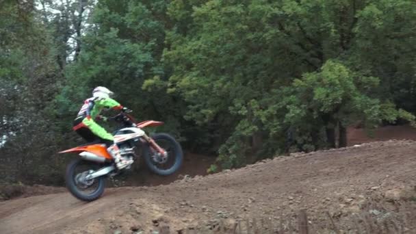 Motocross Rider riding on dirt track — Stock Video