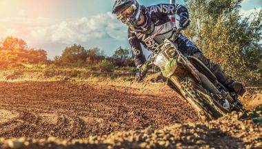 Motocross MX Rider riding on dirt track clipart