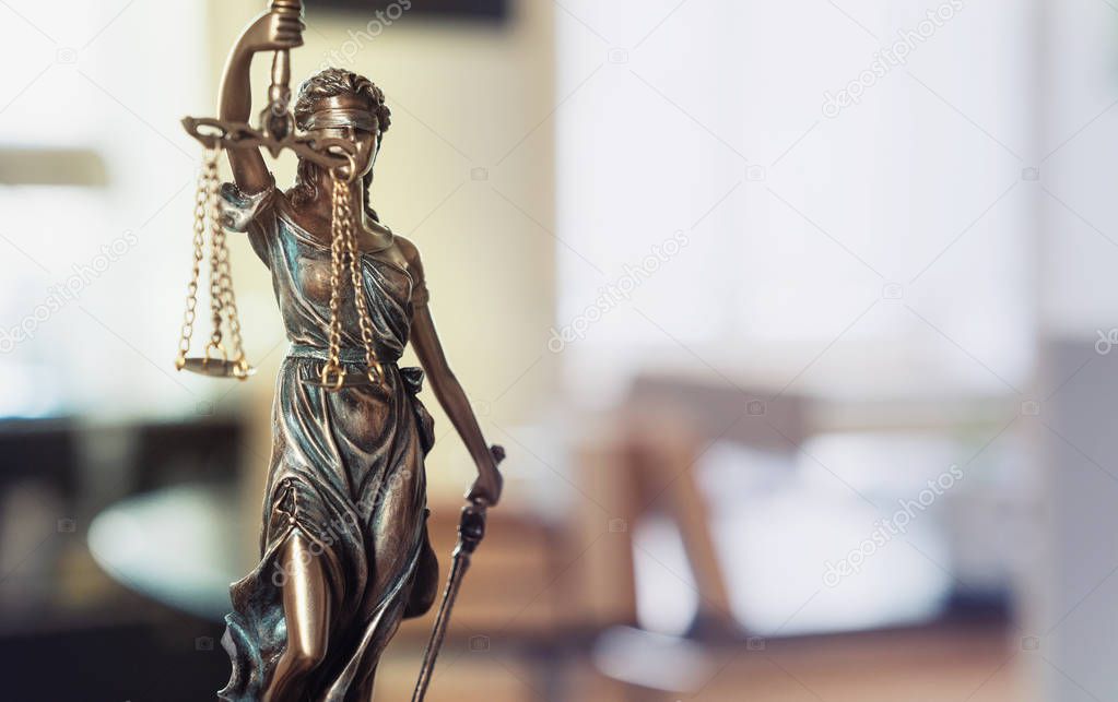 The Statue of Justice - lady justice or Iustitia / Justitia the Roman goddess of Justice in lawyer office