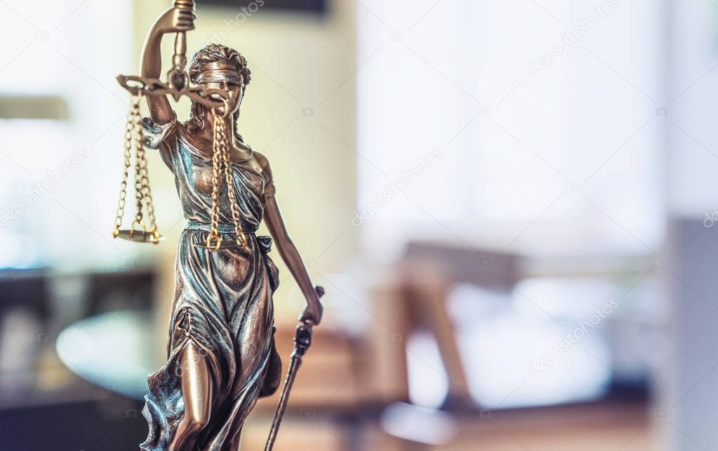 The Statue of Justice - lady justice or Iustitia / Justitia the Roman goddess of Justice in lawyer office