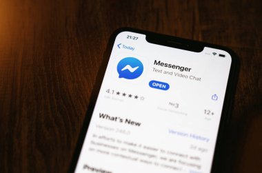 Apple iPhone Xs with Facebook messenger app from app store.