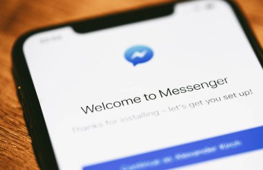 Apple iPhone Xs with Facebook messenger app from app store.