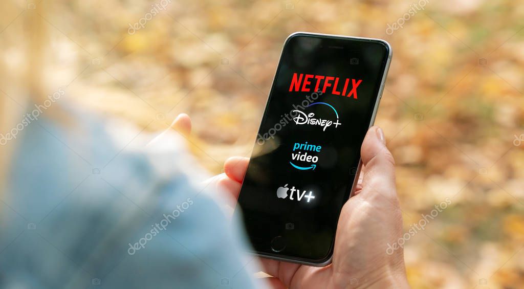 AACHEN, GERMANY - 10. September 2019 : Video Streaming apps like Disney plus, Apple TV plus, amazon prime and netflix on Apple iPhone.