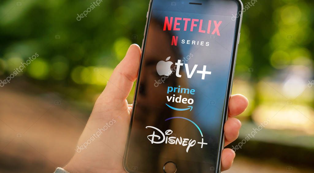 AACHEN, GERMANY - 10. September 2019 : Video Streaming apps like Disney plus, Apple TV plus, amazon prime and netflix on Apple iPhone.