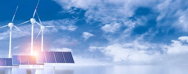 Větrné turbíny a solární panely na modré slunné obloze s některými mraky — Stock fotografie