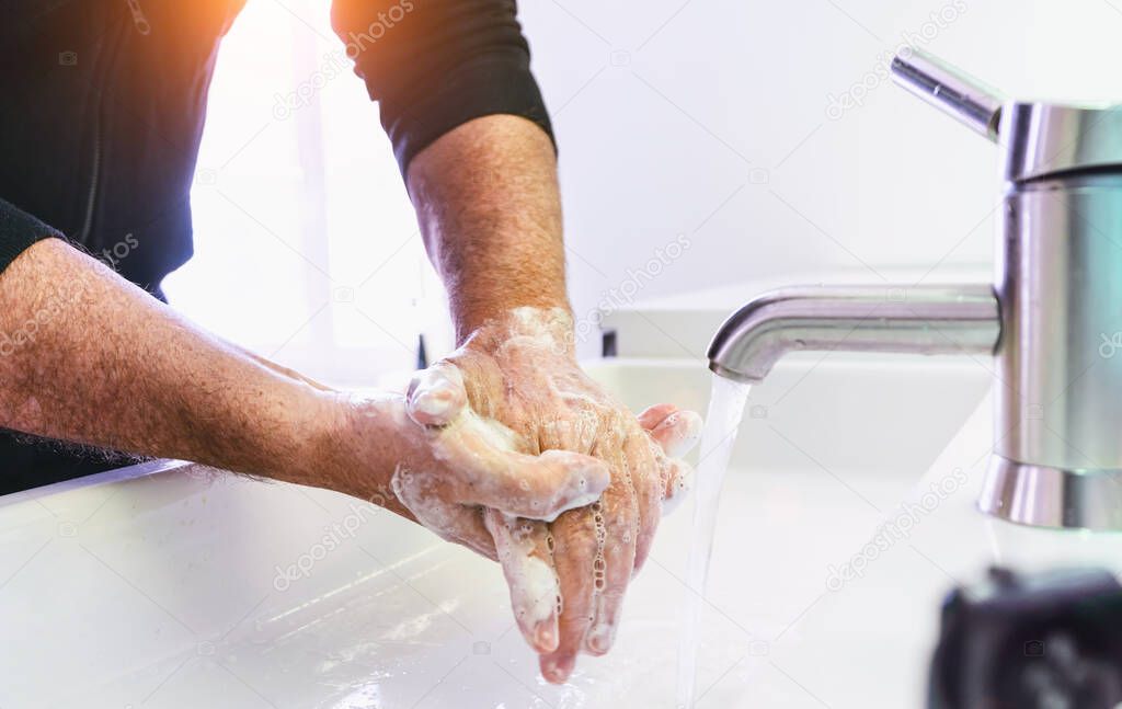 Man washing his Hands to prevent virus infection and clean dirty hands - corona covid-19 concept...