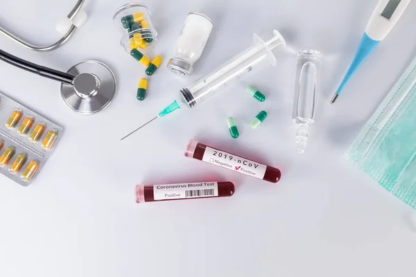 Blood test tube with the Coronavirus disease for virus test and — Stock Photo, Image