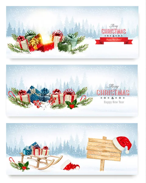 Tres pancartas de Navidad con regalos. Vector . — Vector de stock