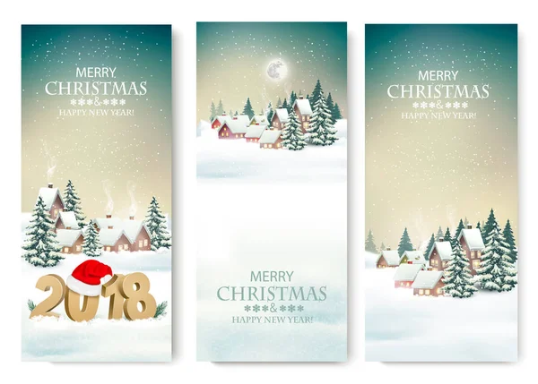 Три праздничных рождественских баннера с зимней деревней и 2018 . — стоковый вектор