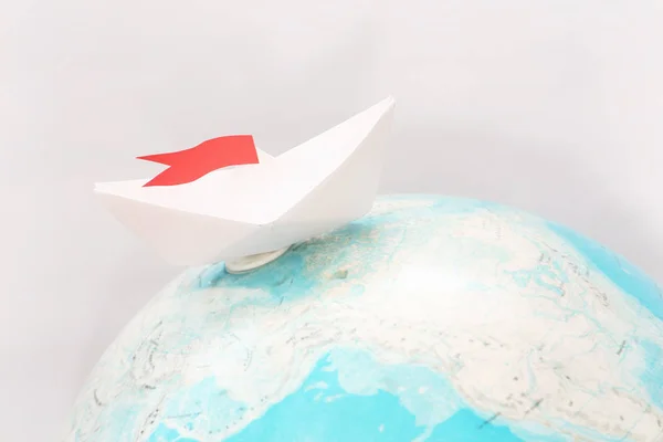 Travel concept with paper boat