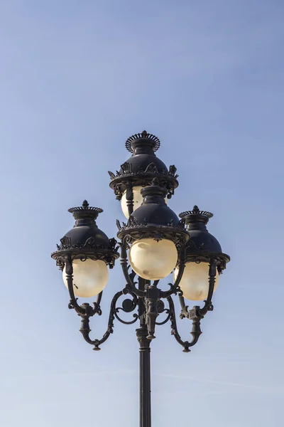 Ornate street light against the blue sky in Tunis, iron lantern — Stock Photo, Image