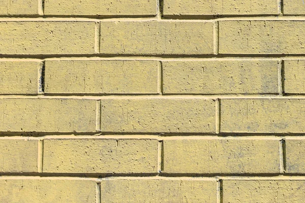 Mur en brique peinte jaune — Photo