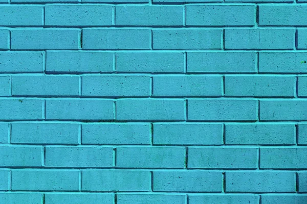 teal painted brick wall
