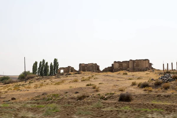 View of flat lands and small hills of the Central Anatolian geography from the road. Central Anatolia has arid climate with hot summers and extremely cold winters.