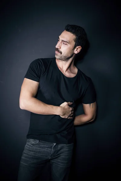 Young handsome man with beard and mustache studio portrait — Stock Photo, Image