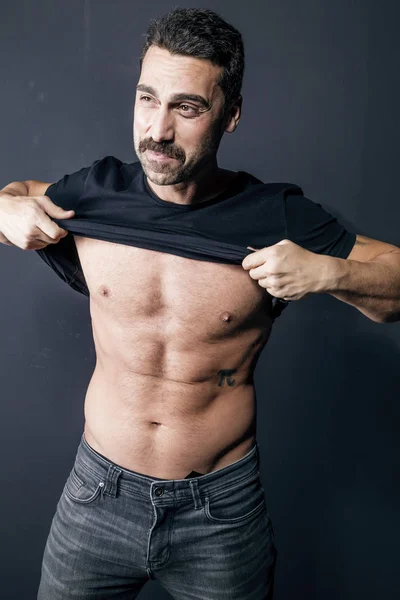 Young handsome man with beard and mustache studio portrait — Stock Photo, Image