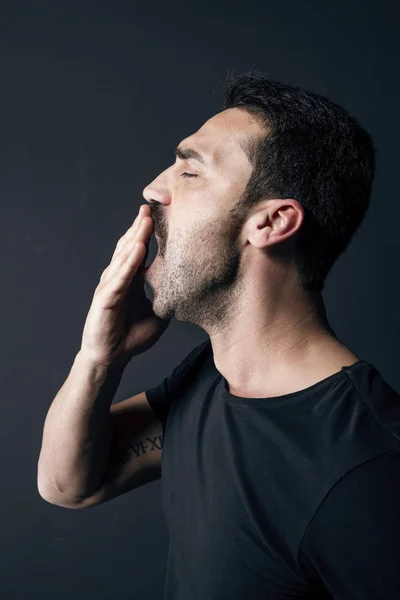 Sleepy man studio portrait — Stock Photo, Image