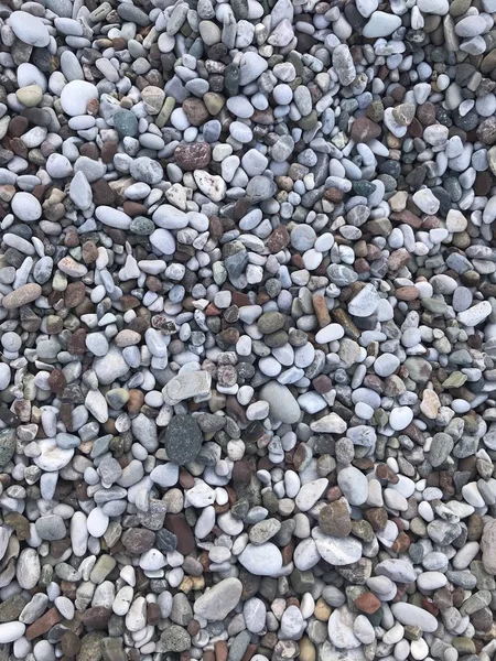ビーチで丸みを帯びた石のテクスチャ画像のカラフルな岩 — ストック写真