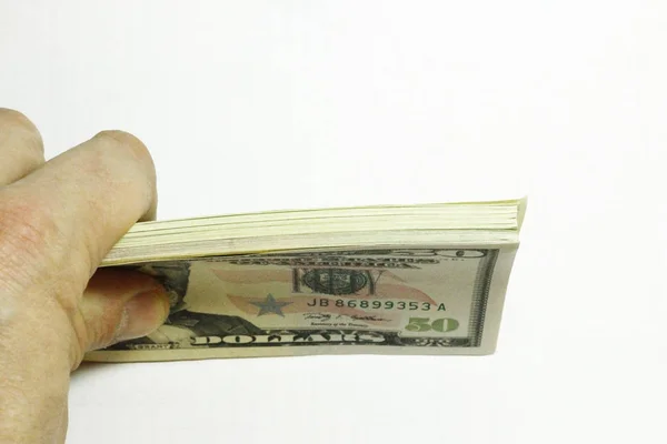 Manos de hombre sosteniendo un montón de dólares de papel EE.UU. en el bac blanco —  Fotos de Stock
