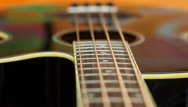 An acoustic bass guitar closeup isolated on the background