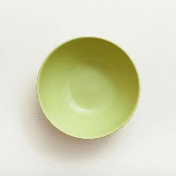 Above view of green bowl on plastering plate — Stock fotografie