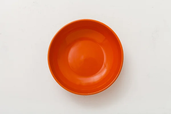 Top view of orange bowl on plastering plate — Stockfoto