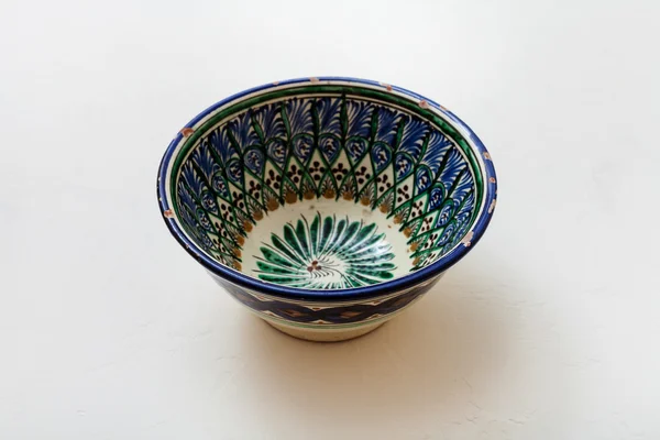 One typical central asian bowl on white plaster — ストック写真