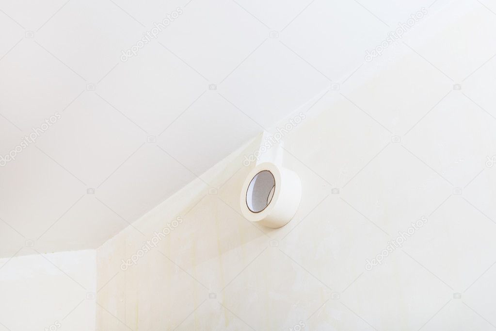 Fixing Adhesive Tape On Wall Before Painting Stock Photo
