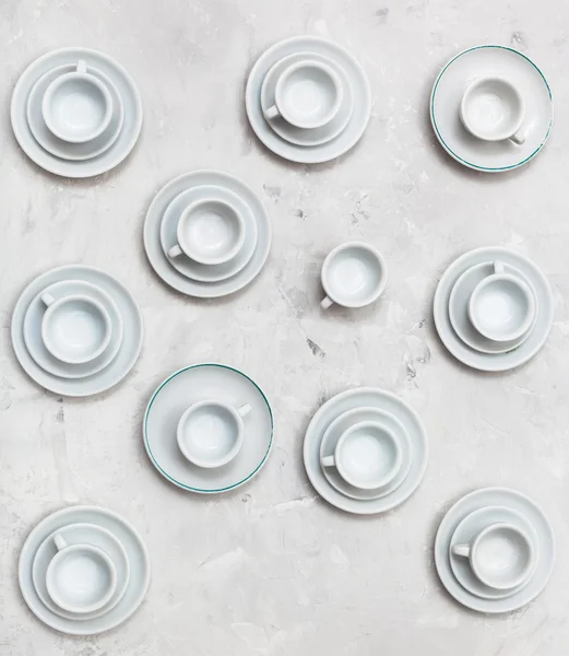 Top view of many cups and saucers on concrete — Stock Photo, Image