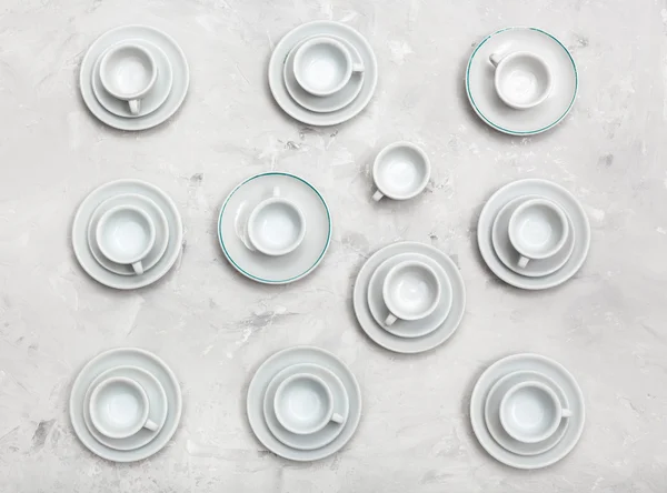 Above view of many cups and saucers on concrete — Stock Photo, Image