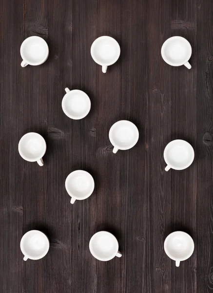 Top view of many white cups on dark brown table — Φωτογραφία Αρχείου