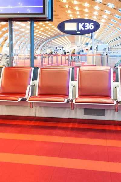 Red seat in departure hall of airport — Stock Photo, Image