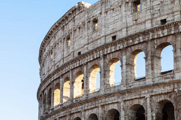 Travel to Italy - walls of ancient roman amphitheatre Colosseum in Rome city in evening