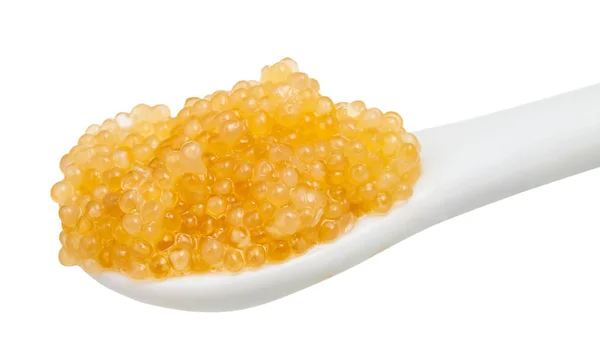 Yellow caviar of pike fish in ceramic spoon — Stock Photo, Image