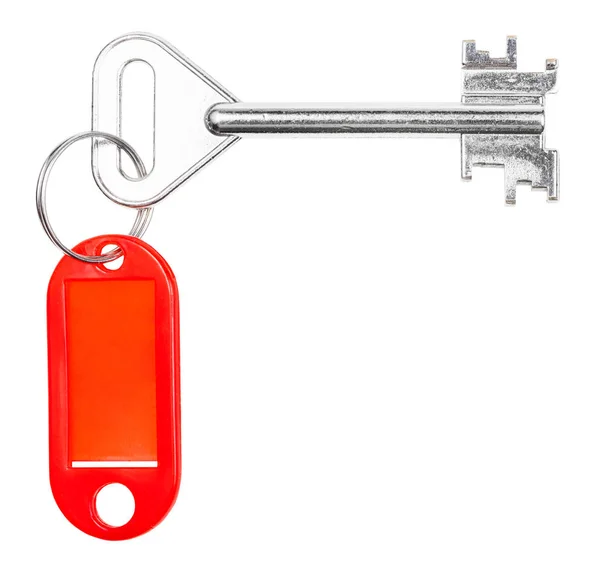 Big door key with red blank key chain isolated — Stock Photo, Image