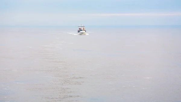 Boat with pilot in Baltic sea in morning mist — Stock Photo, Image