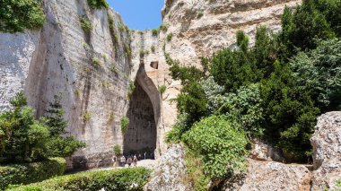 tourists near Orecchio di Dionisio in Syracuse clipart