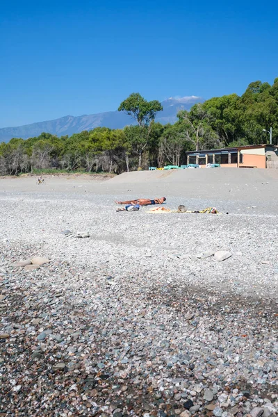 People on beach San Marco on Ionian Sea — Stock Photo, Image